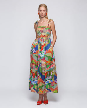 The MIRTO 1956 Multicolor Print Maxi Dress is a sleeveless cotton dress with tie straps, a square neckline, and a vibrant patchwork of floral and geometric designs in red, green, blue, yellow, and purple.