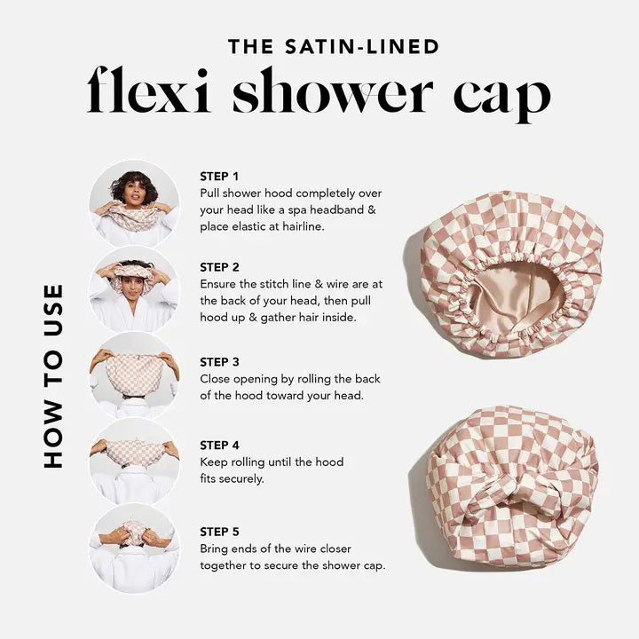 The KITSCH - SATIN LINED FLEXI SHOWER CAP, featuring a checkered pink and white design, is waterproof with satin lining and comes with adjustable closure for various hair types, as shown on its packaging.