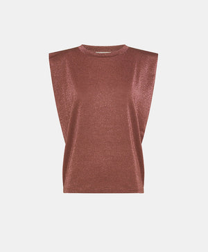 A person with braided hair is wearing a MOMONI ENNA LUREX JERSEY TOP and a skirt featuring a black, white, and green patterned design reminiscent of an 80s interpretation. The background is plain and neutral.