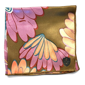 The CLIFTON WILSON Brown Floral Silk Pocket Square features a bold abstract floral print in pink, teal, coral, and brown with brown edges—a striking formal accessory for any suit.