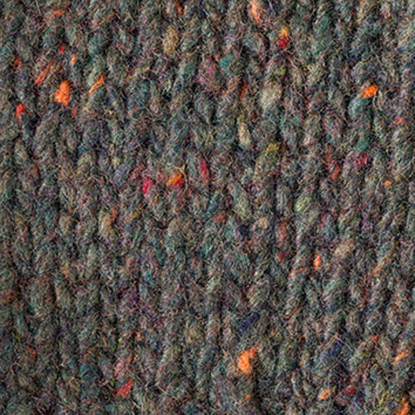 Close-up of the BASE MILANO - HEATHERED CREWNECK SWEATER, a textured, hand-knitted deep red virgin wool piece with multicolored flecks. Made in Italy by BASE MILANO.