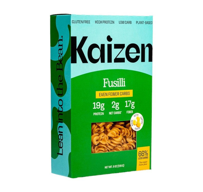 KAIZEN FOOD COMPANY's KAIZEN - FUSILLI features a blue and green box with a window showing the pasta. The plant-based, gluten-free, low-carb fusilli offers 19g protein, 2g net carbs, and 17g fiber per serving.