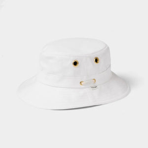 A person wearing the TILLEY - ICONIC T1 BUCKET HAT IN WHITE and a white shirt is shown from the back against a light gray background—a stylish, breathable cotton hat by TILLEY, perfect for sun protection.
