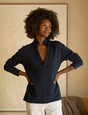 Introducing the FRANK & EILEEN - Patrick Popover Henley Triple Fleece by FRANK & EILEEN. This dark-colored shirt features a collar and a deep V-neck opening, along with long sleeves for added warmth. Made from luxuriously soft and comfortable Triple Fleece fabric, the hem and sleeves have a slightly distressed, casual look. Easy to care for, this stylish Henley is machine washable and showcased against a plain, light background.
