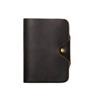 The WP STANDARD - LEATHER PASSPORT HOLDER IN BLACK by WP STANDARD showcases your US passport, featuring a suede-like interior and side pocket—ideal for organizing travel essentials.