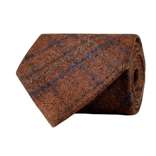 A rust-colored checked wool tie from Amanda Christensen, featuring a subtle checked pattern in varying shades of rust, shown on a white background.