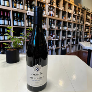 A bottle of MAISON CHANZY ‘LES BUSSIERES’ MERCUREY 2022 with a dark foil capsule and a cream-colored label featuring a blue and white crest.