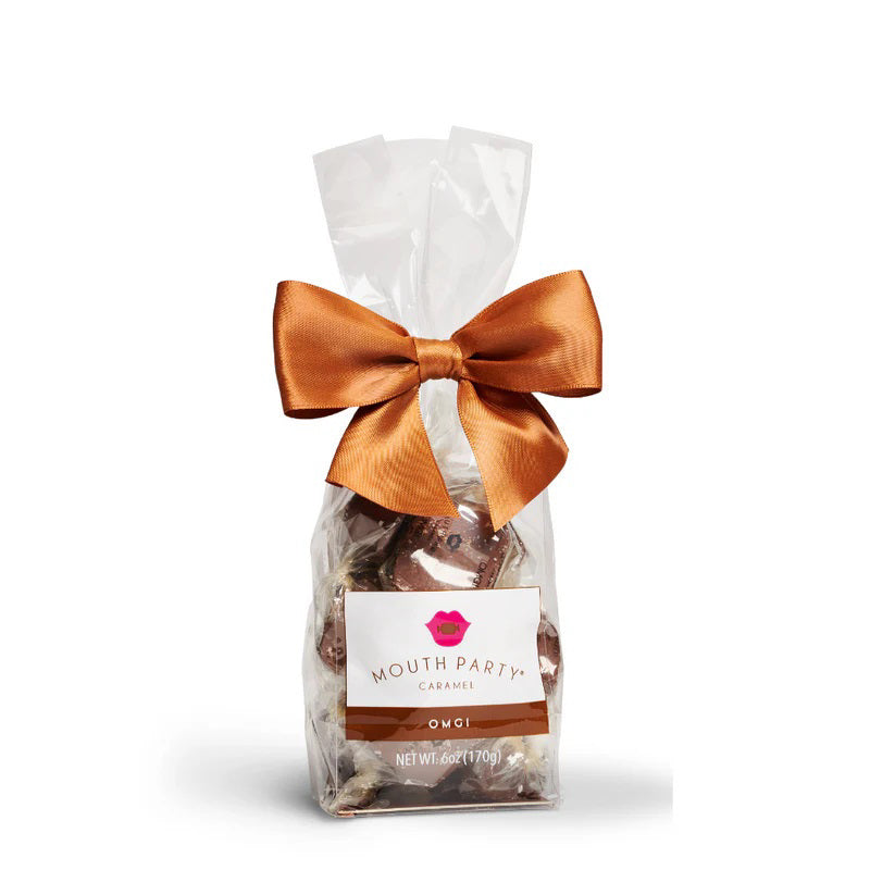A clear bag of MOUTH PARTY - OMG BAG caramels, including sea salt caramel, is tied with a copper satin bow. The label says &quot;Mouth Party Caramel OMG! NET WT. 6oz (170g).&quot; Brand: MOUTH PARTY.