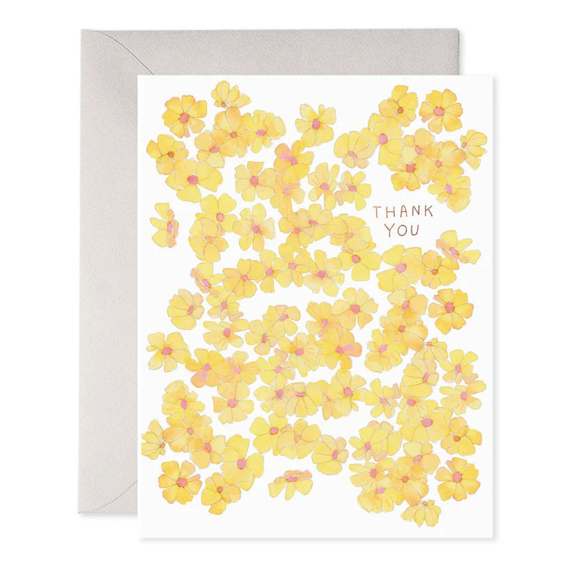 The E. FRANCES PAPER - YELLOW FLOWERS THANK YOU GREETING CARD features floral illustrations of yellow flowers with pink centers and "Thank You" written in uppercase letters among the blossoms, complete with an envelope.