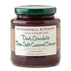 A jar of STONEWALL KITCHEN- DARK CHOCOLATE SEA SALT CARAMEL SAUCE from Stonewall Kitchen, featuring a green lid and a white label that includes details such as “gluten free” and “net weight 354g (12.5 oz).”.