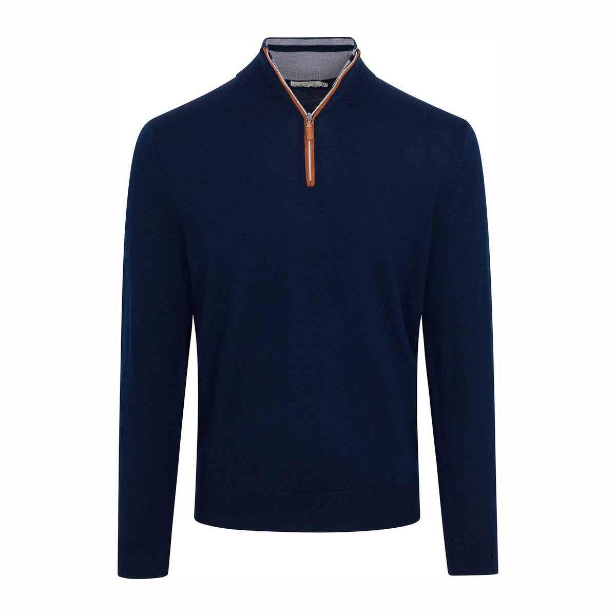A man wearing the COLLARS AND CO - CASHMERE TOUCH AUSTRALIAN MERINO WOOL 1/4 ZIP SWEATER IN NAVY WITH BROWN SUEDE TRIM and a collared shirt stands outside a white building with large windows, looking to the side with his arms folded.