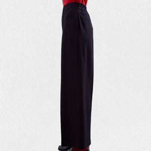 A pair of MEIMEIJ - Pull On Straight Leg Long Pants in black with a red waistband peeking out from the top, worn by a person against a light gray background. These full-length pants from MEIMEIJ feature a clean, minimalist design with no visible pockets or embellishments; they might just become your new favorite.