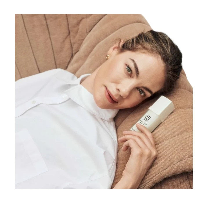 A white rectangular 15ml bottle of U BEAUTY RESURFACING COMPOUND with black text and a minimalist logo, designed to resurface and brighten skin while targeting fine lines and wrinkles.