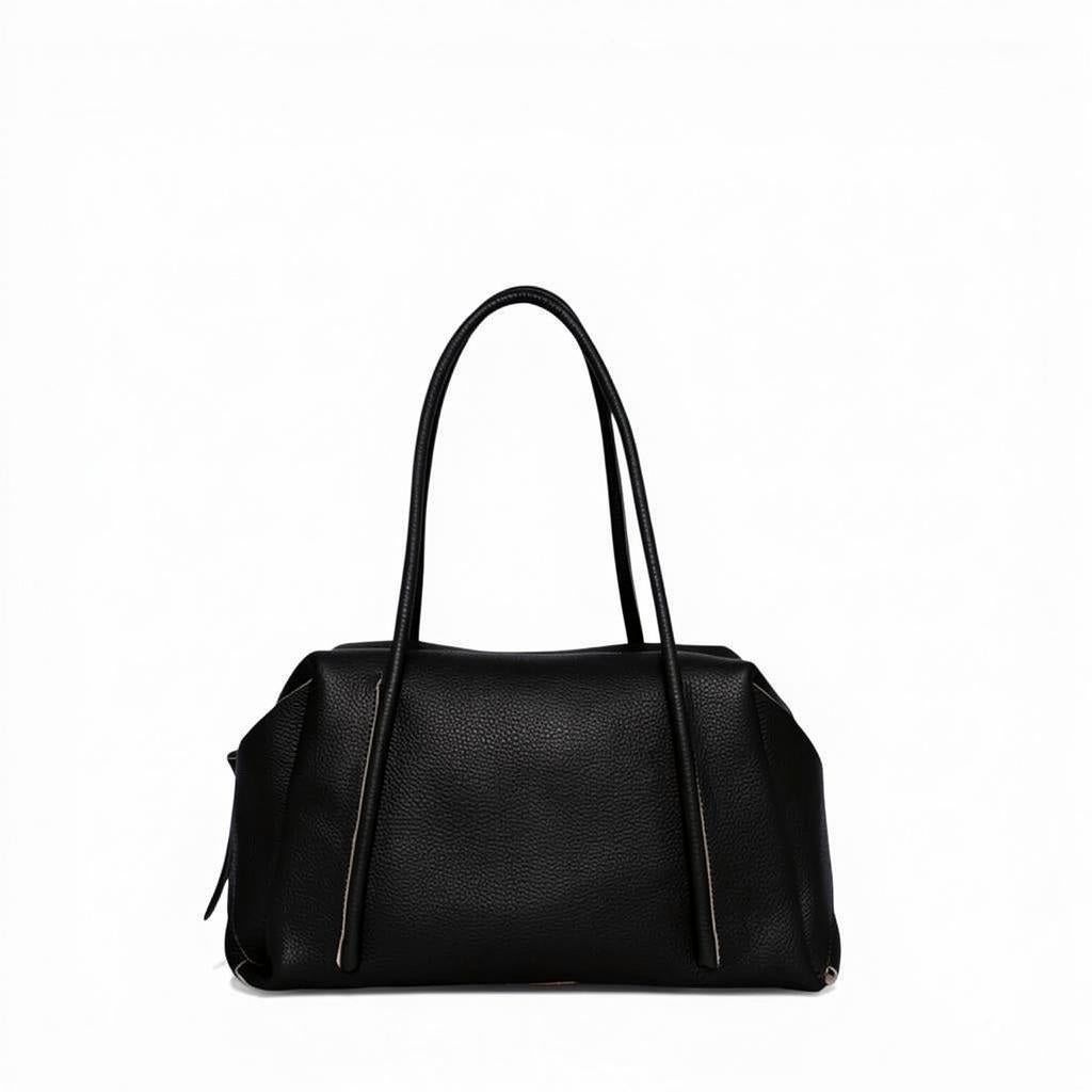 OLIVEVE Solara Satchel in black Italian buffalo cowhide with long handles, a side zipper, and a top zipper closure.