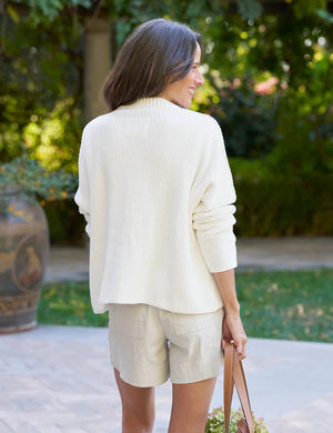 Discover the FRANK & EILEEN Montecito Cardigan, a cream-colored ribbed design made from luxurious Italian cotton. This cozy piece has a round neck, long sleeves, and four large horn buttons down the front for elegance.