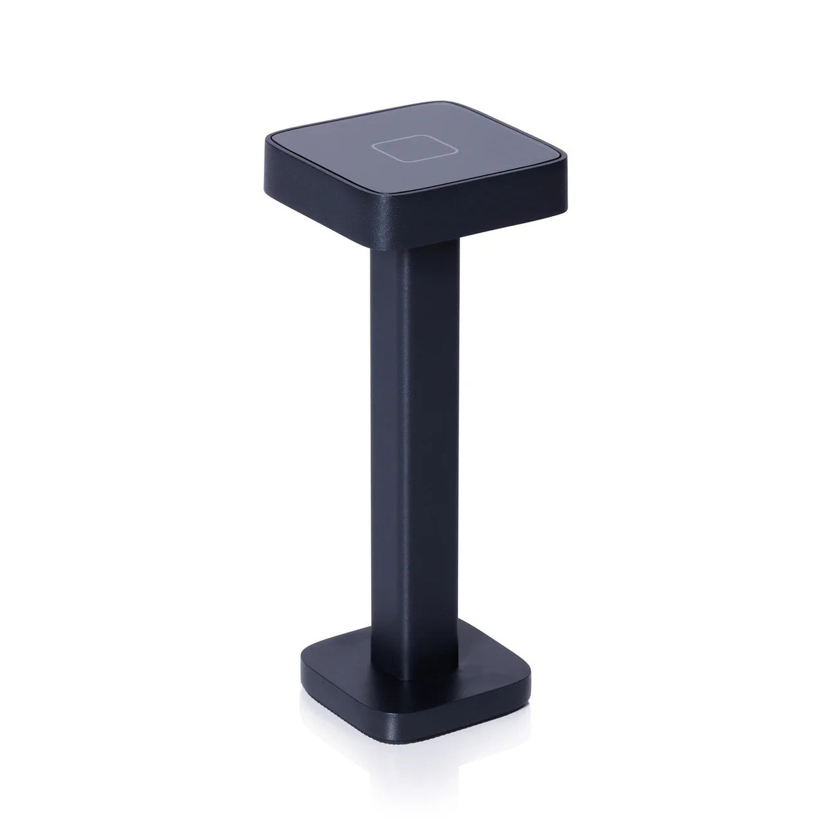 The ZODAX MONZA RECHARGEABLE TABLE LIGHT is a black, rectangular, pedestal-shaped device with a square touchpad on top, offering USB rechargeable capability and adjustable light intensity, shown upright on a white background.