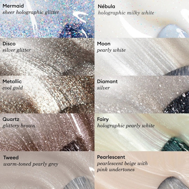 A close-up of a brush spreading MANUCURIST - GREEN™ NAIL POLISH IN QUARTZ by MANUCURIST INC, showcasing its shimmery, metallic brown vegan formula with visible sparkles and swirling patterns.