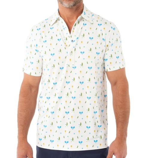 A man wears the CRIQUET Performance Sport Range Polo in white with a blue and yellow pickleballer print, standing against a plain background. This breathable men's polo is perfect for golf or any occasion.