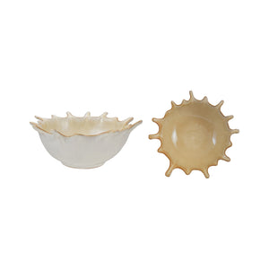 A close-up of the CREATIVE COOP STONEWARE SUNBURST BOWL, a beige ceramic piece with a glossy finish and brown-tinted edges, featuring handcrafted textured details and pointed tips inspired by a leaf’s natural form.