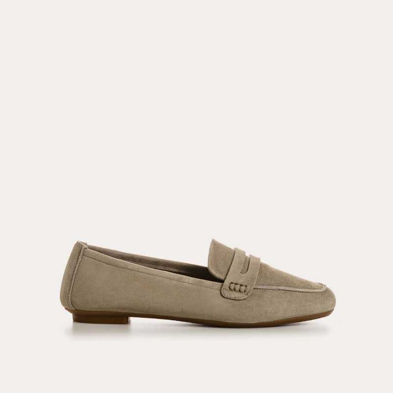 The REQINS HEMA suede loafers in Cactus feature a classic penny slot detail, leather insole, and visible toe stitching, shown against a white background.