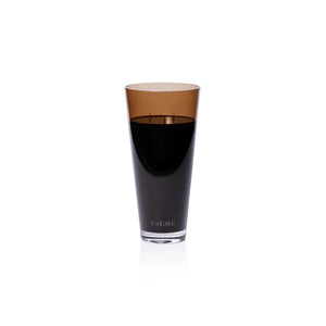 A collection of ZODAX luxury scented candles, including the 57 OZ THISTLE ESTATE CANDLE in black and smoky brown, is displayed on a white textured surface against a plain light background.