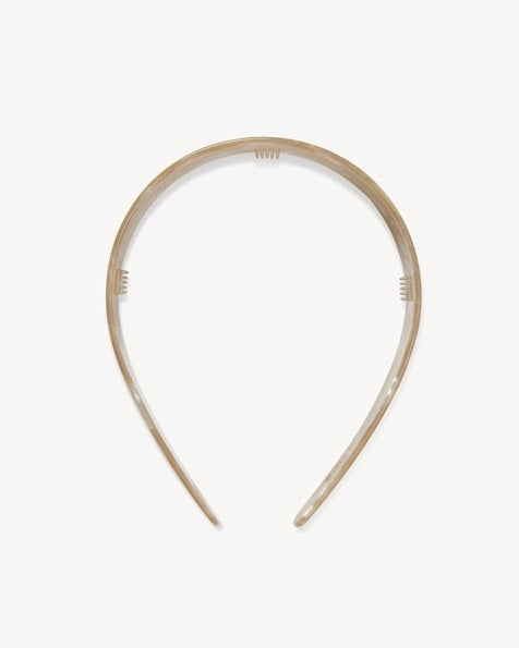 The MACHETE - Wide Headband in Sand Shell by MACHETE is a wide, marbled beige accessory crafted from lightweight Italian acetate with a glossy finish, displayed on a plain white background.