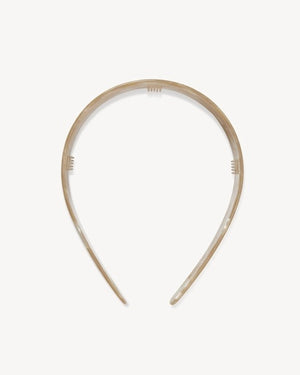 The MACHETE - Wide Headband in Sand Shell by MACHETE is a wide, marbled beige accessory crafted from lightweight Italian acetate with a glossy finish, displayed on a plain white background.