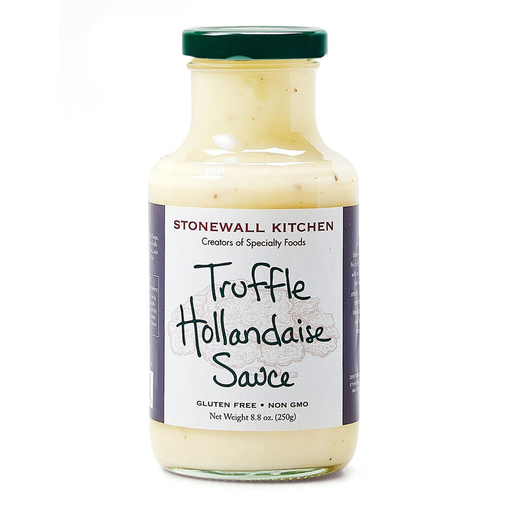 Indulge in a luxurious eggs Benedict with STONEWALL KITCHEN- TRUFFLE HOLLANDAISE Sauce. This gluten-free and non-GMO product boasts a net weight of 8.8 oz (250g). The jar is adorned with a green lid against a white background, exuding the rich aroma of black truffles.