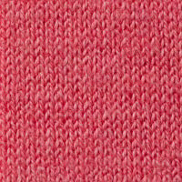 A person with light skin and brown hair pulled back wears the KINROSS MICRO GARTER EASY VEE NECK COTTON SWEATER IN CORAL with blue jeans, standing against a plain white background, one hand in their pocket.