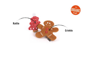 A festive, eco-friendly cat toy from PLAY PET LIFESTYLES/BRANDS, the FELINE FRENZY - MEOWY CHRISTMAS features a plush gingerbread man with white icing details and red buttons standing next to a plush red Christmas tree adorned with white patterns and topped with a white pom-pom—perfect for the holiday season.