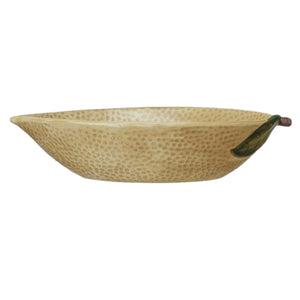 The CREATIVE COOP HAND-PAINTED STONEWARE LEMON SHAPED BOWL, LARGE features a yellow, dimpled surface with brown and green accents—perfect citrus-themed kitchen decor for a fresh touch.