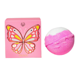 The MUSEE - BUTTERFLY BOXED BATH BALM by MUSEE, a handcrafted pink and white bath balm, sits beside its matching pink box adorned with a vibrant butterfly illustration and the “musee” logo at the bottom. Made with natural ingredients, this luxurious bath product promises a soothing and indulgent experience.