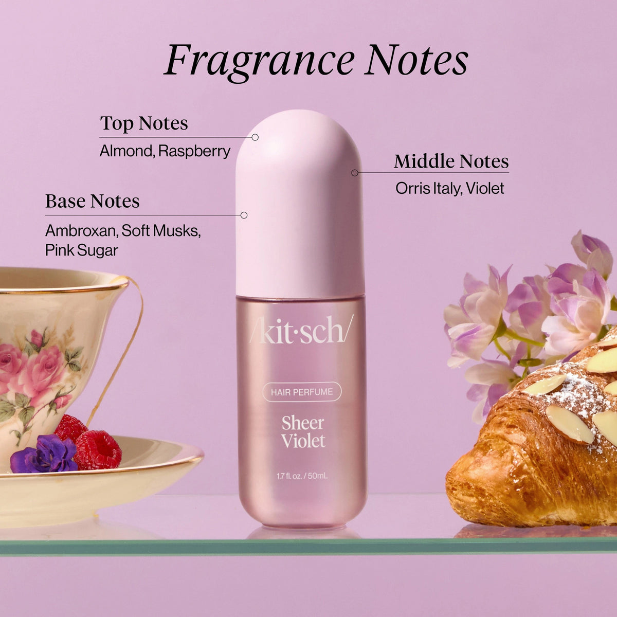 A 1.7 fl oz (50 ml) bottle of KITSCH - SHEER VIOLET HAIR PERFUME, featuring vegan, odor-eliminating technology, sits beside its matching light purple box with white text.