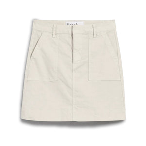The FRANK & EILEEN Jameson Utility Skirt in Cement is a light beige, knee-length skirt with belt loops, large utility pockets, and a front seam detail, crafted from Italian Performance Linen and shown against a white background.
