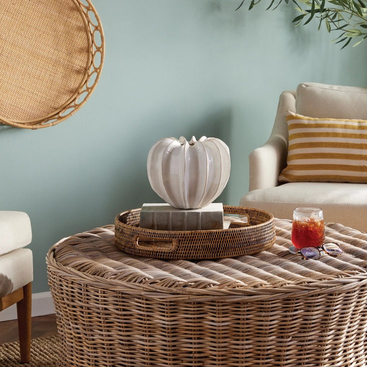 The NAPA HOME AND GARDEN - BLECKLYN POT is a white, glossy ceramic piece with a pumpkin-like form and pleated segments, featuring an artisan touch. Its uneven, scalloped opening evokes the essence of curated coastal-inspired design.