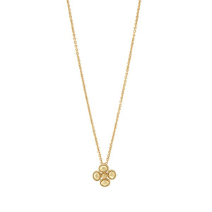 The CAPUCINE DE WULF - BERRY CLOVER STATION NECKLACE features a delicate 18K gold chain with handmade berry clover pendants, each displaying four round gold circles in a charming clover-like design.