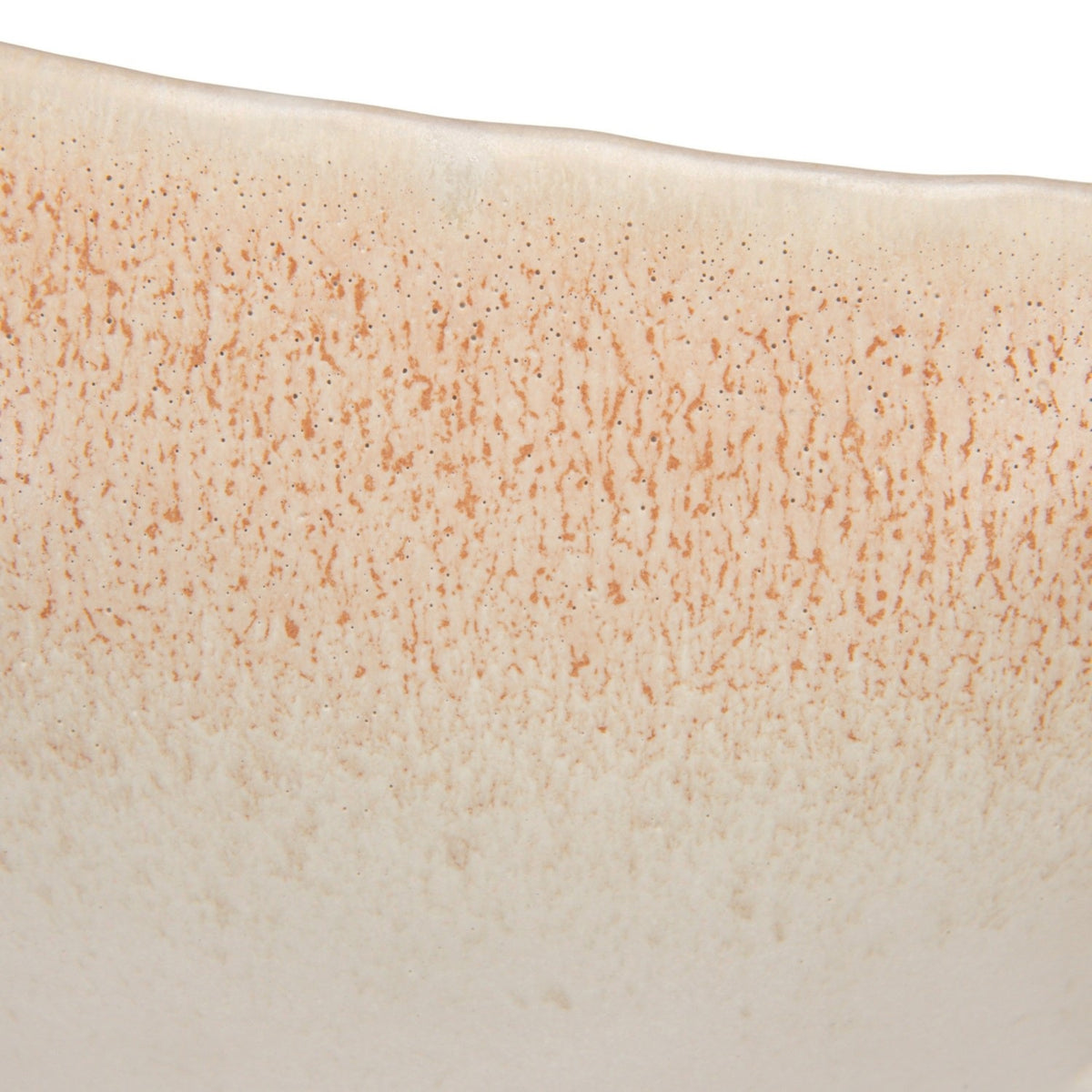 A close-up of the CREATIVE COOP WHITE SPECKLED BIRD-SHAPED STONEWARE FOOTED BOWL, featuring a gull-inspired design with a long beak and a smooth beige and light brown reactive glaze.