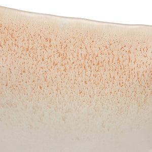 A close-up of the CREATIVE COOP WHITE SPECKLED BIRD-SHAPED STONEWARE FOOTED BOWL, featuring a gull-inspired design with a long beak and a smooth beige and light brown reactive glaze.