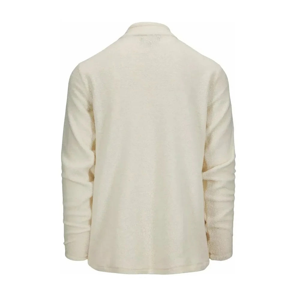The AMUNDSEN SPORTS - HUT HALF-ZIP is a blue wool terry loop pullover with a quarter-zip neckline, zippered chest pocket, and rectangular white label above the pocket. Perfect as a cozy mid-layer sweater.