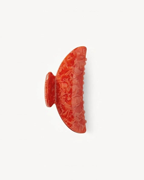 The MACHETE - MIDI HEIRLOOM CLAW by MACHETE is featured against a plain white background. This cream-colored hair accessory is crafted from luxurious Italian acetate and features curved edges with interlocking teeth, making it ideal for securing medium hair with effortless style.