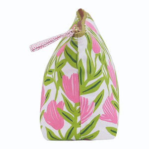 The ROCKFLOWERPAPER PINK DELIGHT POUCH is a zippered cotton canvas organizer with pink flowers and green leaves on white—perfect for storing your essentials.