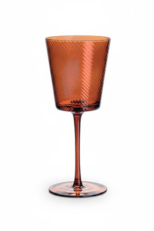 Hand-crafted amber OPTIC SWIRL WINE GLASS with a ribbed, swirling pattern.