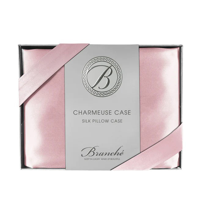 The BRANCHE - CHARMEUSE PILLOW CASE SILK comes boxed with a gray label and pink ribbon, stating “BRANCHE Sleep Luxury. Wake Up Beautiful.” Designed to reduce hair frizz and prevent wrinkles.