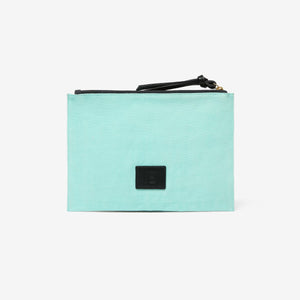 The INOUI EDITIONS - SPLASH EMBROIDERED POUCH by INOUI showcases a rectangular design with vibrant, hand-embroidered fish and coral on a light blue backdrop. This pouch features seaweed in shades of green, pink, blue, and brown, highlighting exquisite textile art.