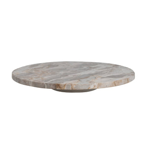 The CREATIVE COOP MARBLE LAZY SUSAN features a round, flat design with light brown and beige veining, displayed on a white background. Its slightly raised base creates an elegant elevated look—perfect as a kitchen centerpiece for entertaining.