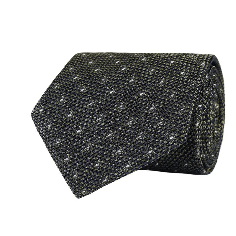 An elegantly rolled olive green grenadine woven silk tie by AMANDA CHRISTENSEN, featuring a refined polka dot pattern and showcasing exquisite Italian craftsmanship.