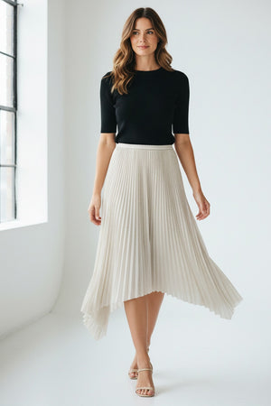 The SEVENTY VENEZIA Pleated Lurex Jersey Skirt with Asymmetrical Hem by SEVENTY features a shimmering silver lurex jersey fabric, elastic waistband, and an uneven asymmetrical bottom, presented against a plain white background.