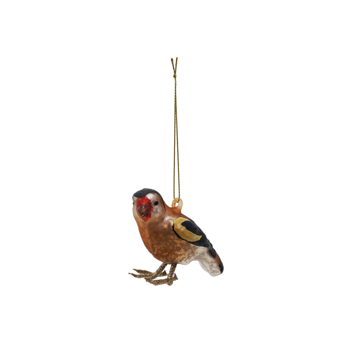 The CREATIVE COOP BIRD ORNAMENT WITH GLITTER features a small, realistic glass bird with yellow and red markings, perched on a wooden block with light brown dried moss, set against a plain, light background.