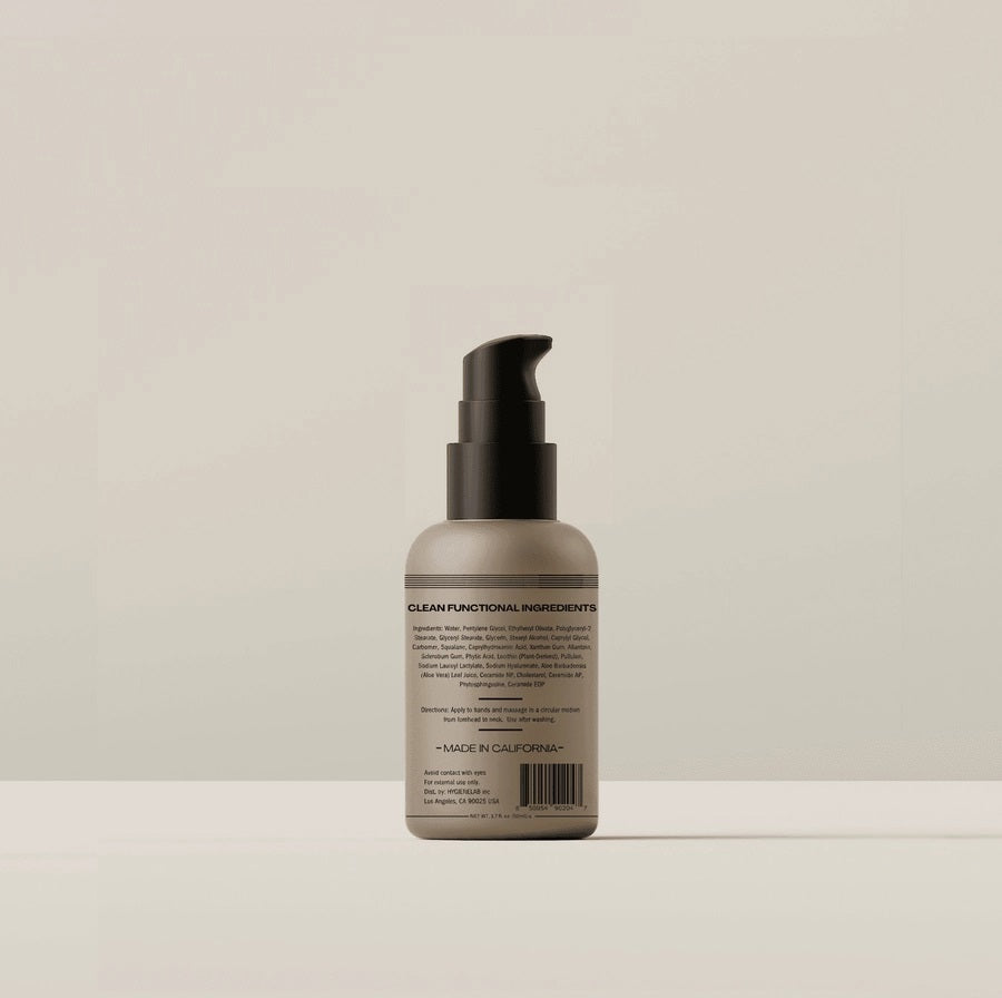 A beige bottle with a black pump, labeled “HYGIENELAB - FACE MOISTURIZER, UNSCENTED,” sits against a white background; this product from HYGIENELAB is formulated with ceramides and hyaluronic acid to provide optimal hydration.
