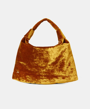 The MOMONI - FRANCOIS VELVET BAG by MOMONI is a teal hobo bag with a slouchy design and a single handle. Made in Italy, it features a small, gold "m" logo on the lower left side. The bag has an overall soft and plush texture, crafted from luxurious crushed viscose velvet.